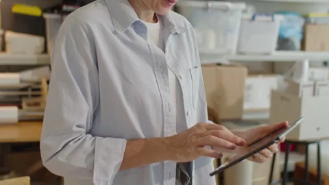 Female Manager Using Tablet in Delivery Service Warehouse Video stock 238691918