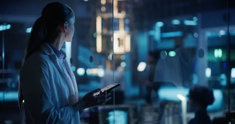 Female Manager Using Tablet in Office with Quantum Computer Stock Footage 318965258