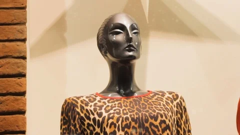 Female mannequin in a leopard jacket style fashion pattern Stock Footage 121384930