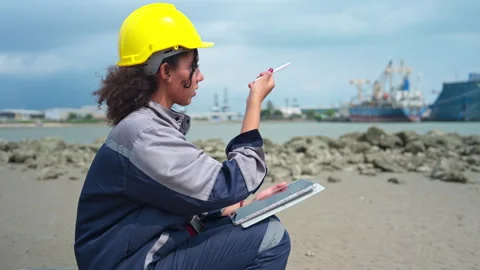 Female maritime engineer using digital tablet for logistics management Stock Footage 341337149