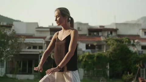 Female master alone practicing qigong traditional exercises outdoors Stock Footage 257670444