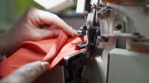 Female master tailor in making preparations for the red dress Video stock 126940373