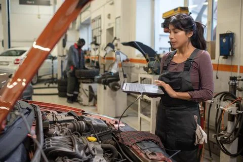 Female Mechanic Checking Engine Errors Stock Photos