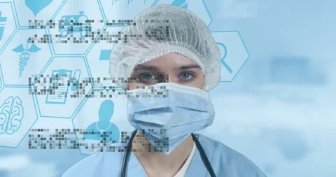 Female medic facing camera pixels appearing left forming hex icons over mask Stock Footage 326974625