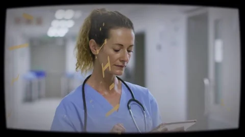 Female medic tapping tablet, checking medical chart, gold overlay drifting, Stock Footage 334040673