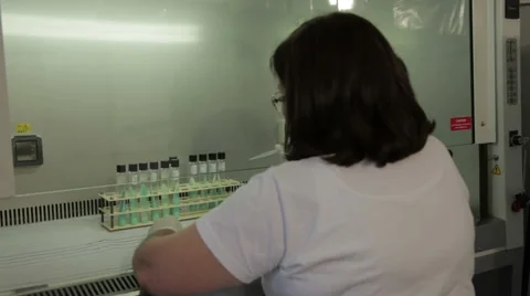 Female medic technician analyzes samples for tuberculosis, close up. Stock Footage 50258239