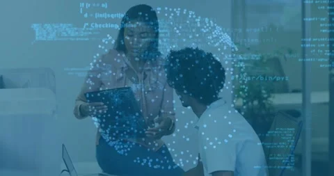 Female mentor showing tablet, pointing to touchscreen, guiding male mentee Stock Footage 334036620