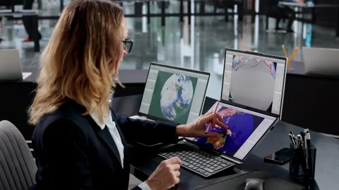 Female Meteorologist Analyzing Climate Data On Computer Screen Stock Footage 330585555