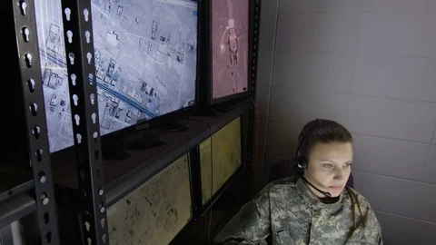 Female military drone operator, wide shot Stock Footage