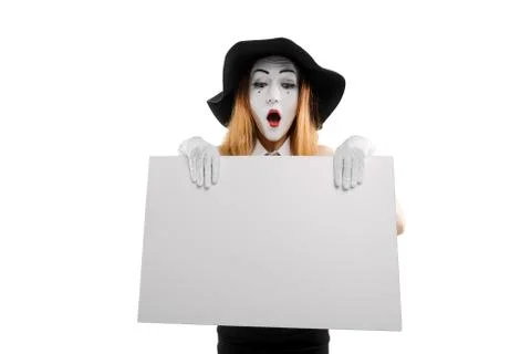 Female mime holding blank board. Place for your text or picture Stock Photos