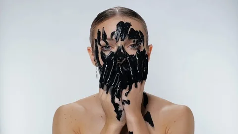 Female model apply mud mask face cosmetic. Environmental pollution. Black oil. Stock Footage 120154004