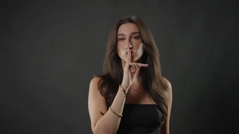 Female model beauty studio concept, young woman posing confidently with hand Stock Footage 336938033