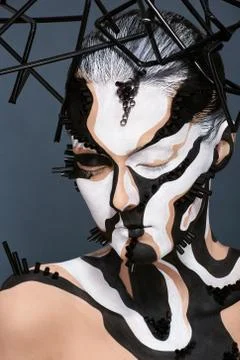 Female model with creative abstract makeup in futuristic hat Stock Photos