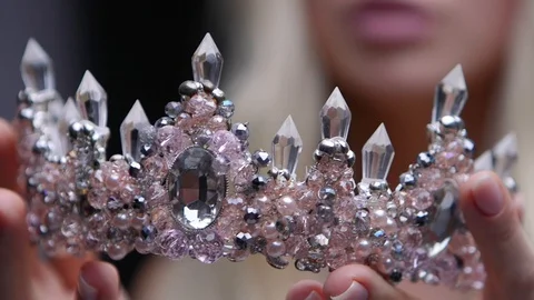 Female model in the crown posing in the studio jewelry Video stock 95622696