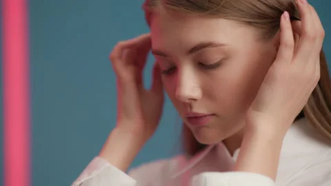 Female model emotionally posing and looking at camera. Portrait of young 20s wom Video stock 199483662