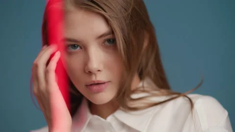 Female model emotionally posing and looking at camera. Portrait of young 20s wom Stock Footage 199483701