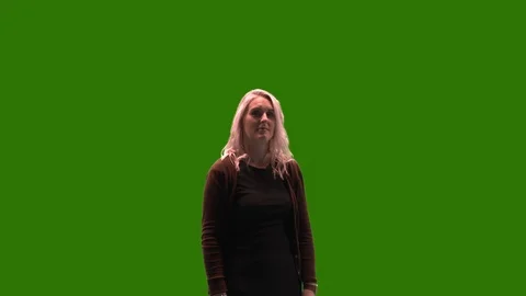 Female model on green screen pointing to... | Stock Video | Pond5