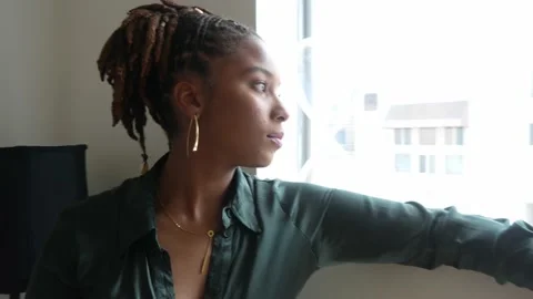 Female model looking out the window Stock Footage 196358697