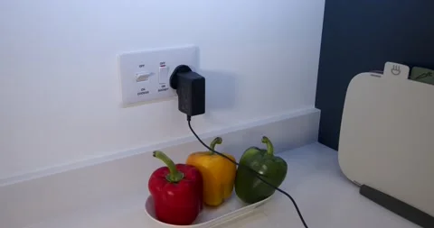 Female model plugging in a power adapter plug and turning on then off a Stock Footage 233397835