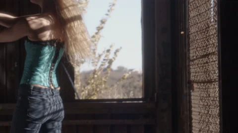 Female model poses in slow motion through shadow 스톡 동영상 45792072