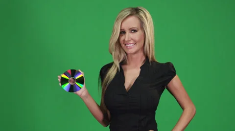 Female model posing with a CD Vídeos de archivo 38498540