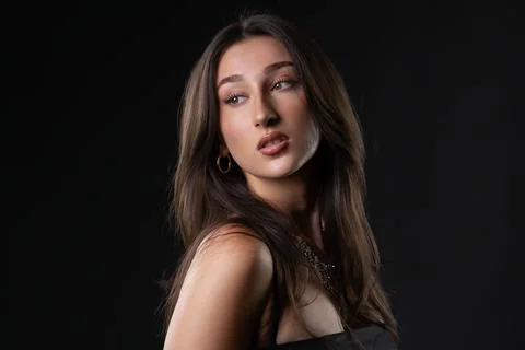 Female model posing with elegance in studio light Stock Photos