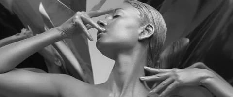Female model posing emotionally and looking at camera. Silver skin girl close-up Stock Footage 160661348