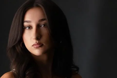 Female model posing looking at camera in studio Stock Photos