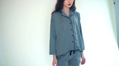 Female model posing in pyjama  in studio slow motion Stock Footage 62199741