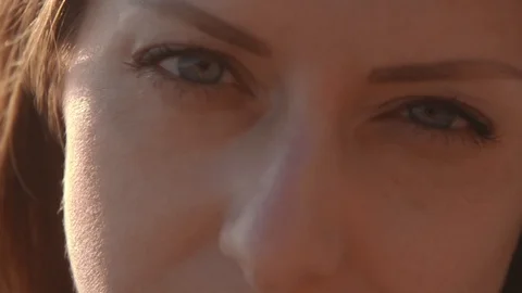 Female model posing on the sea beach at sunset. Face close up Stock Footage 100286323