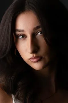 Female model posing in studio with dramatic lighting Stock Photos