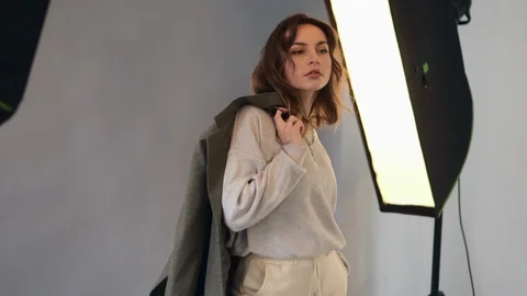 Female model posing at studio during photo shoot. 스톡 동영상 124912305