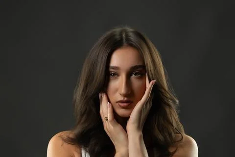 Female model posing in studio showing beauty and elegance Stock Photos