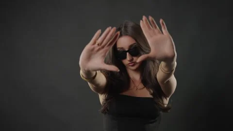 Female model posing with sunglasses and hand gestures, beauty and fashion Stock Footage 336937707