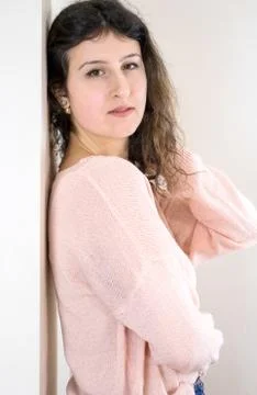 Female model posing on wall Stock Photos