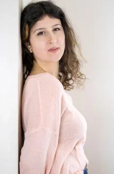 Female model posing on wall Stock Photos