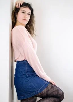 Female model posing on wall Stock Photos