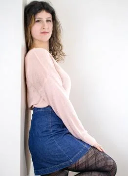 Female model posing on wall Stock Photos