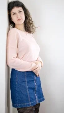 Female model posing on wall Stock Photos