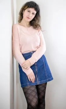 Female model posing on wall Stock Photos