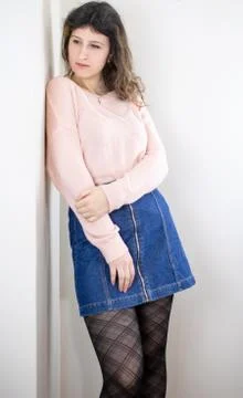 Female model posing on wall Stock Photos