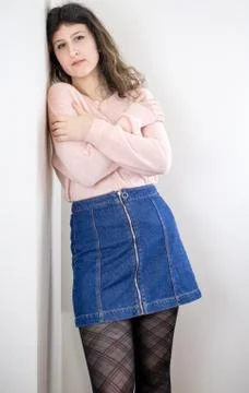 Female model posing on wall Stock Photos