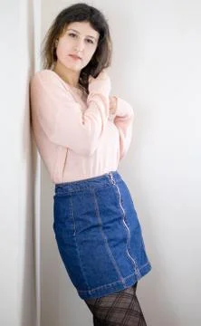 Female model posing on wall Stock Photos