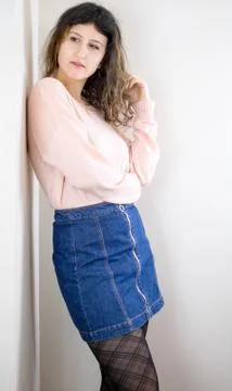 Female model posing on wall Stock Photos