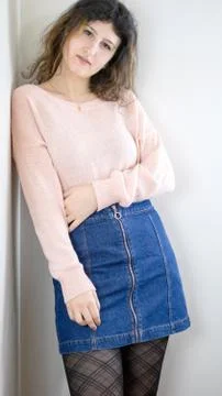 Female model posing on wall Stock Photos