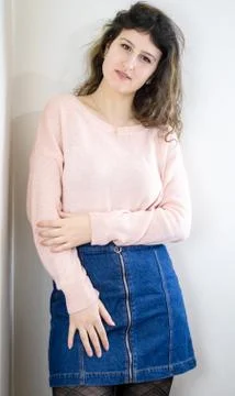 Female model posing on wall Stock Photos