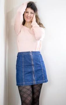 Female model posing on wall Stock Photos