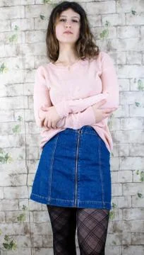 Female model posing on wall Stock Photos
