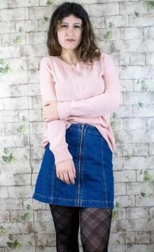 Female model posing on wall Stock Photos