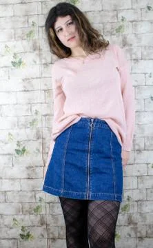 Female model posing on wall Stock Photos